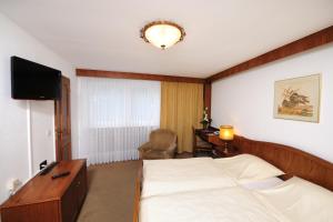 阿尔特波斯特卡尼酒店客房内的一张或多张床位
