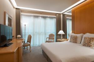 雅典美利亚酒店客房内的一张或多张床位