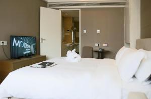 长沙泊富辉盛名致服务公寓客房内的一张或多张床位