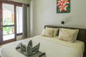 Senggigi Cottages Lombok客房内的一张或多张床位