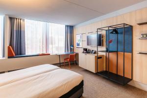 阿姆斯特丹之家酒店客房内的一张或多张床位