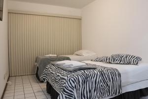 Flat´s Brasília客房内的一张或多张床位