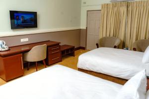 Great Zimbabwe Hotel客房内的一张或多张床位