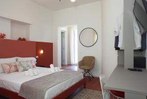 Casa Maja rooms & suites客房内的一张或多张床位