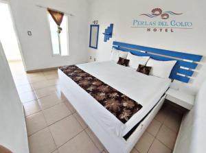 Hotel Perlas del Golfo客房内的一张或多张床位