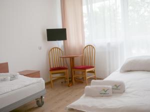 Radość Natura Tour客房内的一张或多张床位