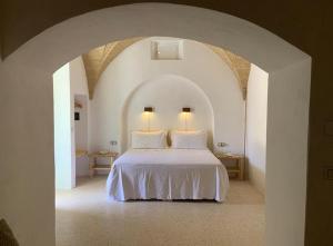 Relais Masseria Sant'Antonio客房内的一张或多张床位