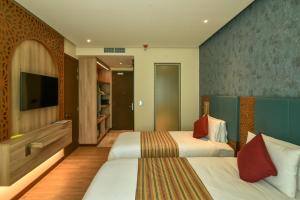 Golden Tulip Zanzibar Airport Hotel & Spa客房内的一张或多张床位