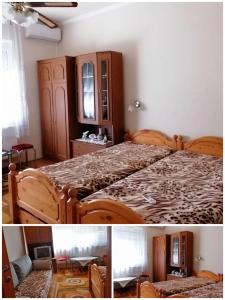 豪伊杜索博斯洛Vida vendégház的一间卧室配有一张床和一个木制橱柜