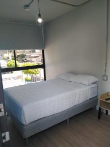 Nomada Republic Hotel Panama City客房内的一张或多张床位