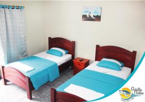 Hotel Galapagos Paradise客房内的一张或多张床位