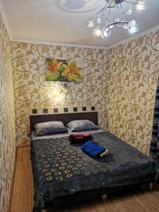 Apartment Studio on Mayakovskogo Avenue客房内的一张或多张床位