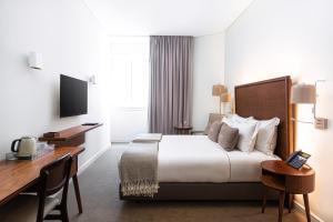 里斯本科尔坡圣托历史酒店客房内的一张或多张床位