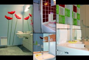 维耶尔宗艾尔驰酒店的墙上有三幅红色鲜花的浴室照片
