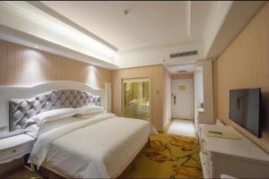 维也纳国际酒店桂林万达店客房内的一张或多张床位