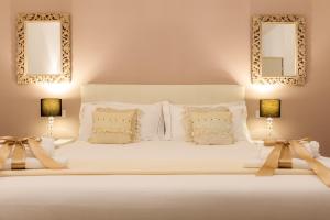 Arcobaleno Suites客房内的一张或多张床位