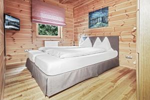 Chalet Dacha mit finnischer Sauna客房内的一张或多张床位