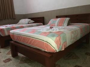 HOTEL LA CASONA客房内的一张或多张床位