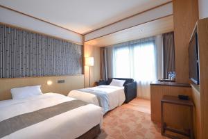 格拉斯丽台北饭店客房内的一张或多张床位