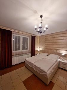Apartamenty Kolorowa客房内的一张或多张床位