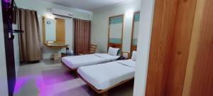 Hotel Easy Retreat客房内的一张或多张床位