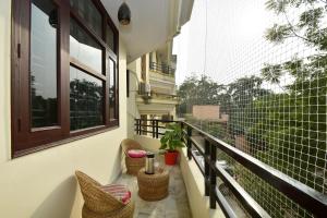 Shanti Villas - Luxury Home Stay Apartment的阳台或露台