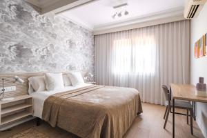 阿斯帕奇亚斯兰布拉加泰罗尼亚套房公寓客房内的一张或多张床位