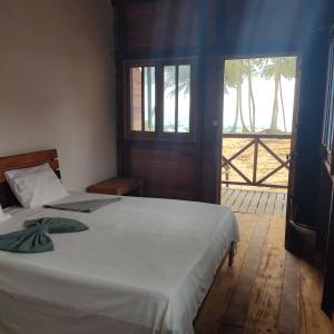 Domus Praia Jalé客房内的一张或多张床位