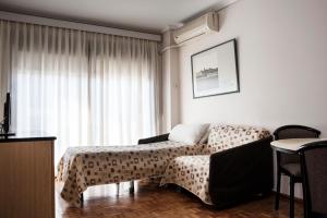 克里斯托弗科伦坡酒店客房内的一张或多张床位