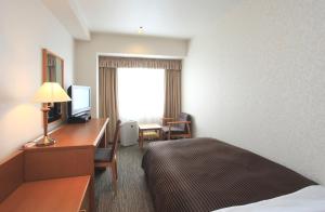 滨松协和酒店客房内的一张或多张床位