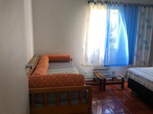 Excelente Apartamento no Canto do Tortuga, praia da Enseada - Guarujá客房内的一张或多张床位