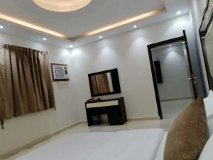 Fakhamat Al Orjoana & Suites客房内的一张或多张床位