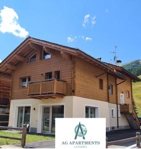 利维尼奥AG Apartments Livigno centro的前面有标志的建筑