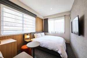 Hotel Pagong with M's客房内的一张或多张床位