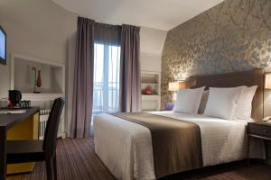 TRYP巴黎布兰驰枫丹酒店客房内的一张或多张床位