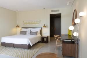 OZADI塔维拉酒店 客房内的一张或多张床位