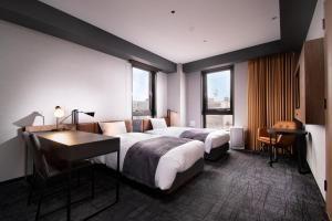 Joytel Hotel Osaka Shinsekai客房内的一张或多张床位