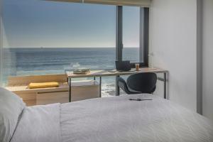 Pullman Vina del Mar San Martin客房内的一张或多张床位