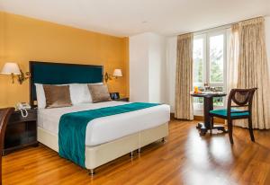 波哥大勒马努瓦尔酒店客房内的一张或多张床位