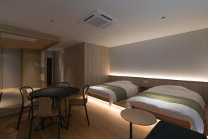 Design Hotel Kyoto Fuyacho客房内的一张或多张床位