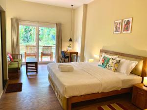 Flower Valley Plantation Homestay客房内的一张或多张床位