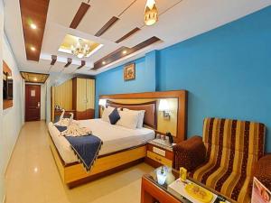 Hotel Ponmari residencyy客房内的一张或多张床位