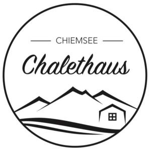 基姆湖畔普林Chalethaus-Chiemsee - 268 qm Ferienhaus am Chiemsee - Neubau的城堡的标志