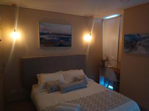 Exclusivo apartamento en Cartagena con vista al mar客房内的一张或多张床位