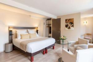 Best Western Plus Hôtel Belfort Centre Gare客房内的一张或多张床位