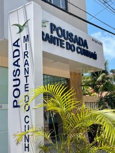 巴拉多库努Pousada Mirante do Cunhaú的波科马地亚尼桑尼斯诊所的标志
