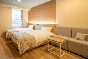 HOTEL AMANEK Asahikawa客房内的一张或多张床位