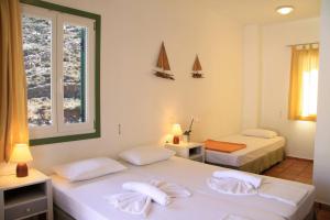 马尔加多酒店客房内的一张或多张床位