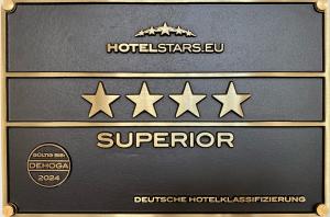 弗莱堡 弗莱堡斯塔德特酒店的盒子上装有四星,上面装有胡德尔星