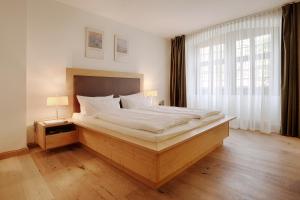 HOTEL WIENER BOTSCHAFT Veitshöchheim - by homekeepers客房内的一张或多张床位